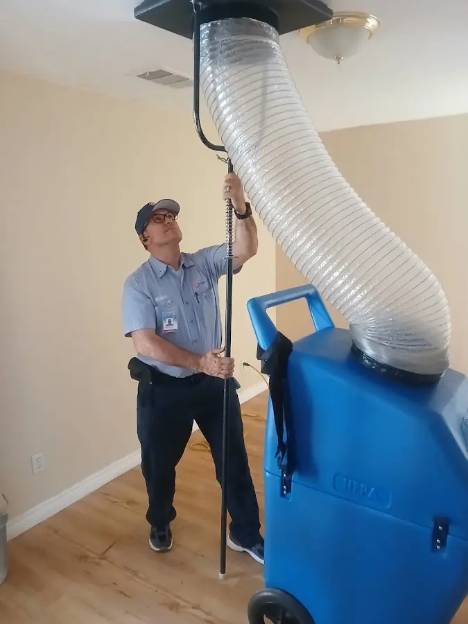 Furnace Tune-Up technician using HEPA equipment in Athens